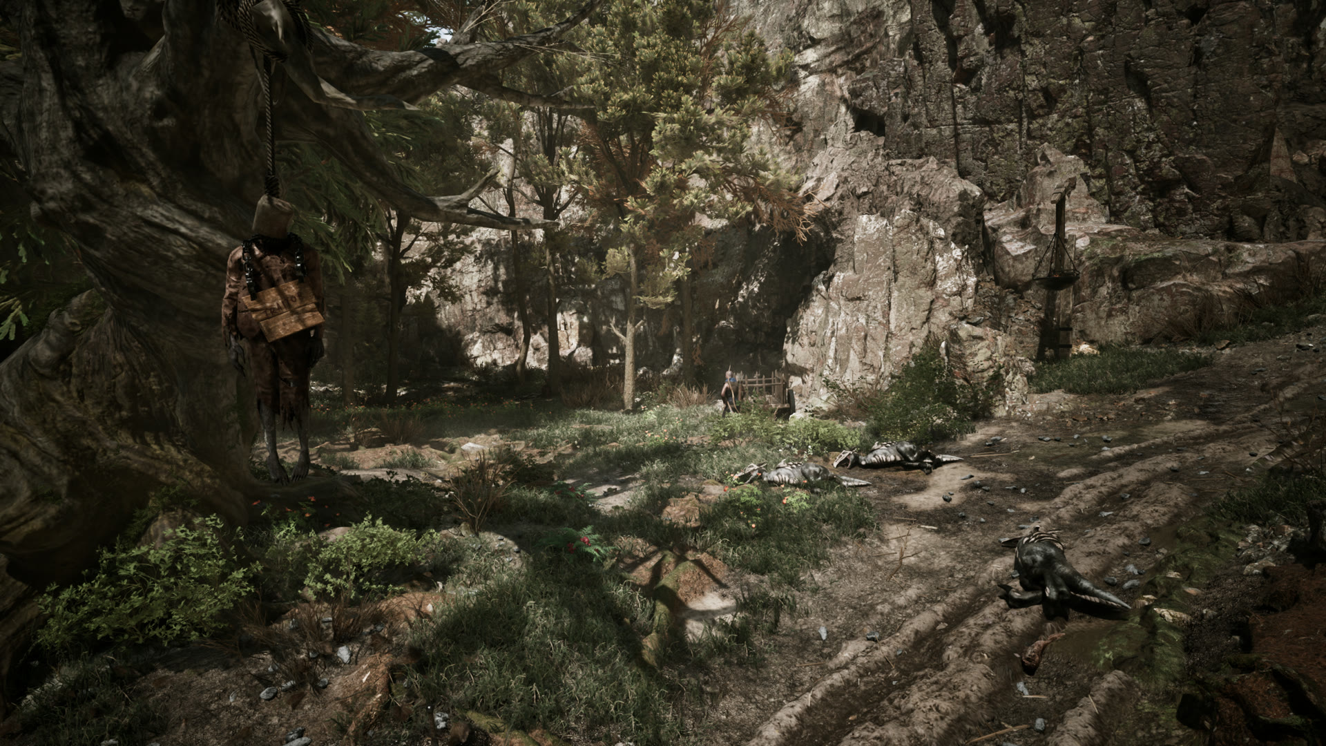 Gothic 1 Remake bestiary — creature carcasses lie along a forest trail below a hanged corpse