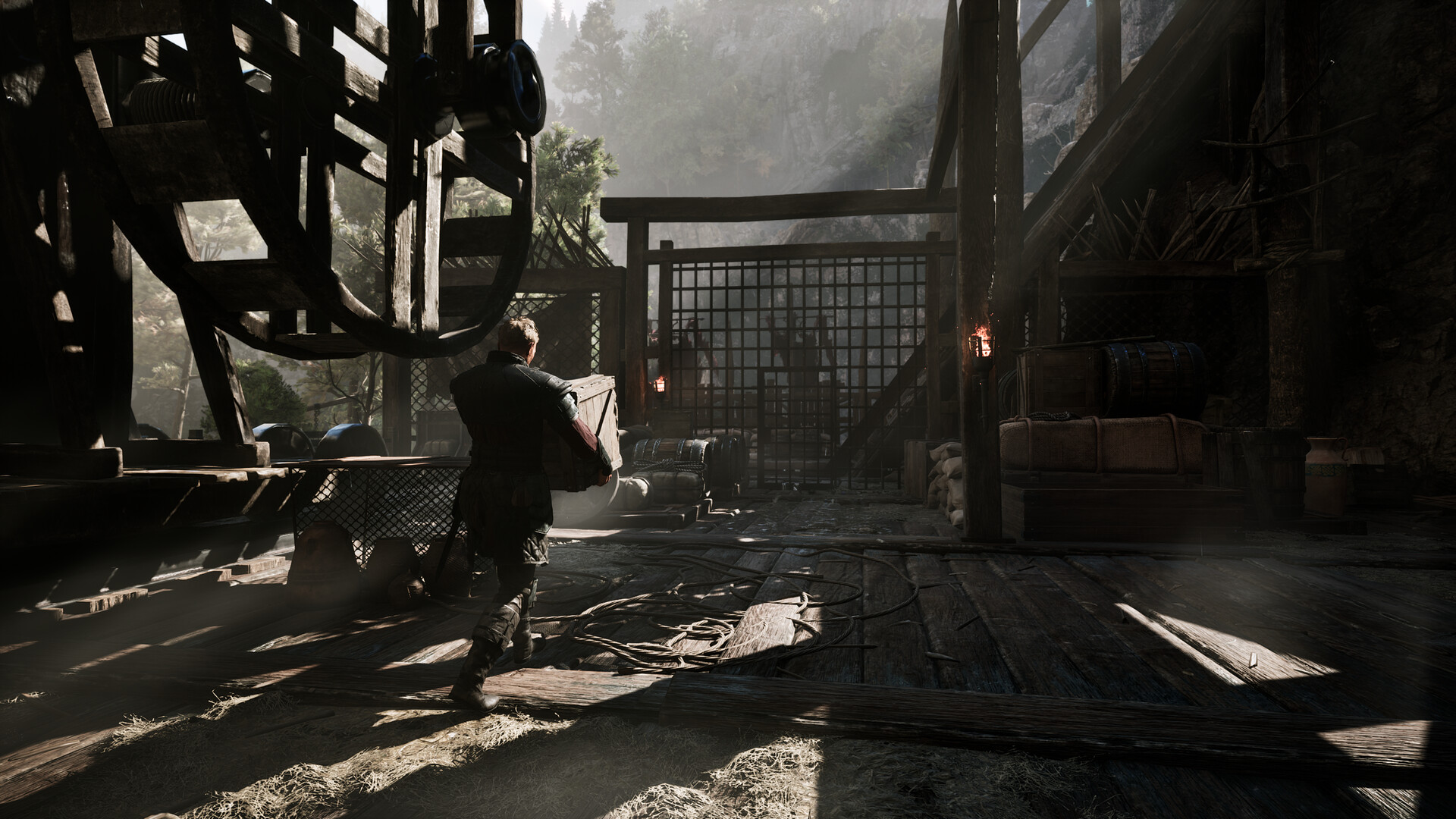 Gothic 1 Remake camp — a prisoner hauls an ore crate through the colony's timber mine workings near the New Camp