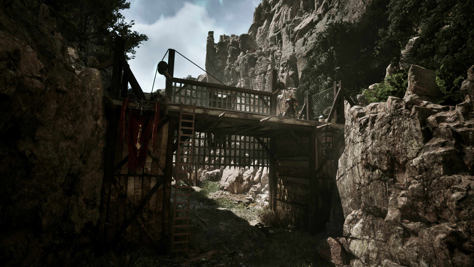 Gothic 1 Remake mining — a timbered gated mine entrance built into a canyon cliff
