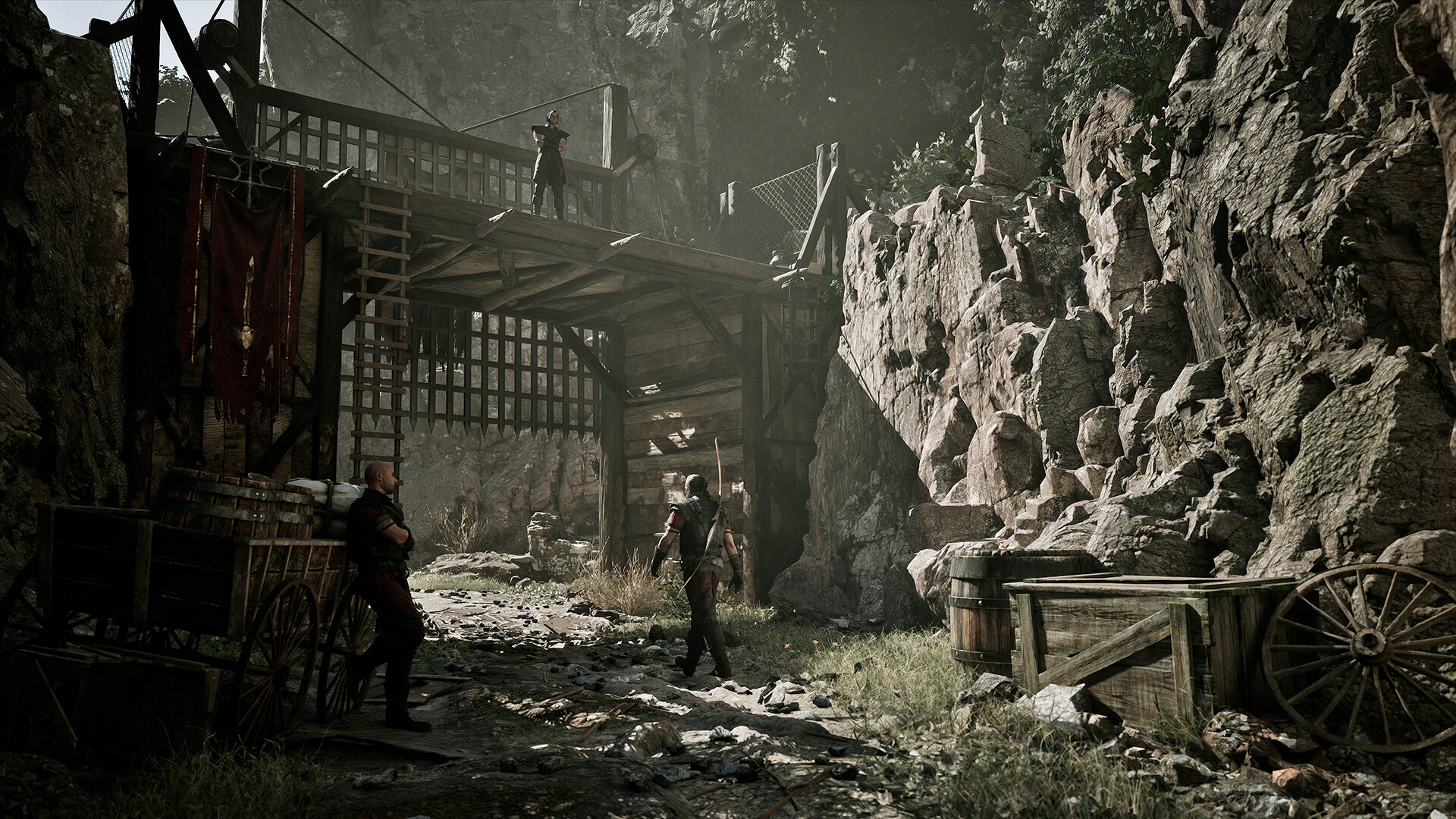 Gothic 1 Remake Old Camp — a guard keeps watch over a timber gateway in a rocky pass into the camp